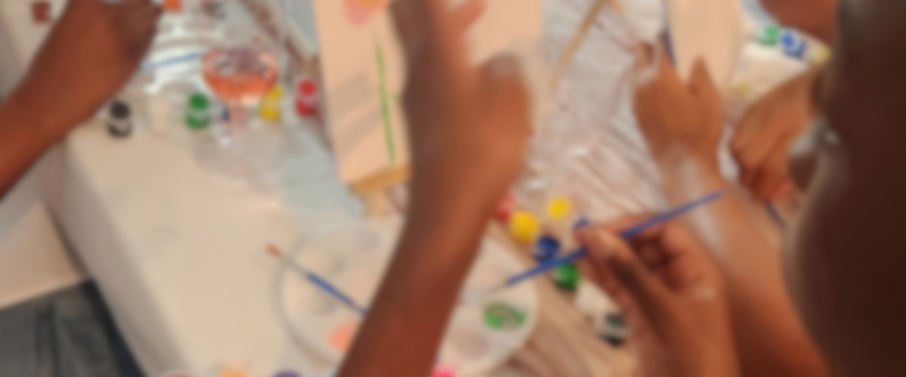Little hands painting canvases at a lo & littles party